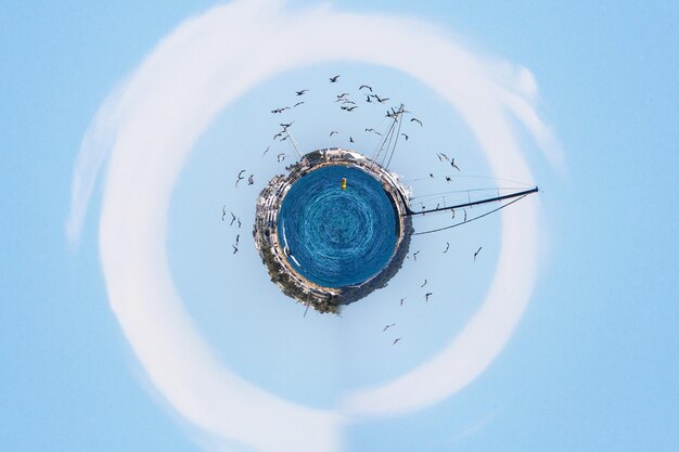 Close-up of umbrella against clear blue sky