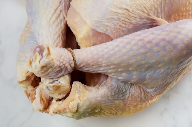 Close up uncooked raw turkey isolated on white background.