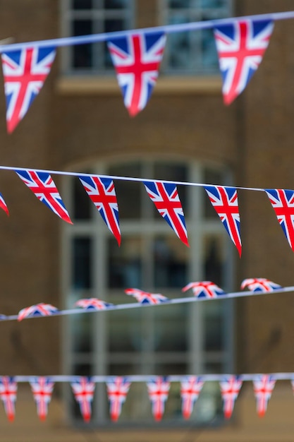 Close-up of union jack bunting against building