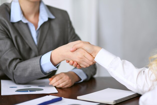 Close up  of unknown  business people handshake