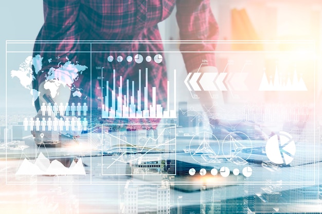 Close up of an unrecognizable woman in a red checkered shirt standing in an office near her desk. Graphs in foreground. Toned image double exposure mock up. Elements of this image furnished by NASA