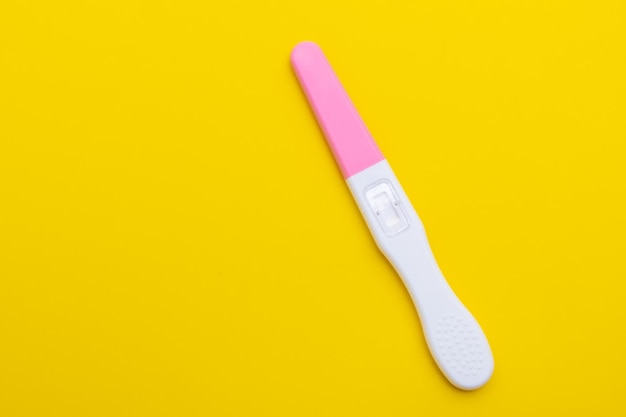 Close up unused pregnancy test on the orange background