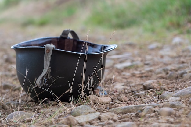 Close up on US M1 helmet on the ground