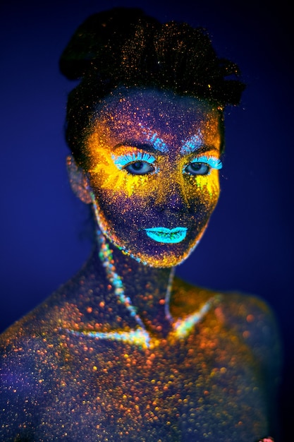 Close up uv portrait glowing in a dark