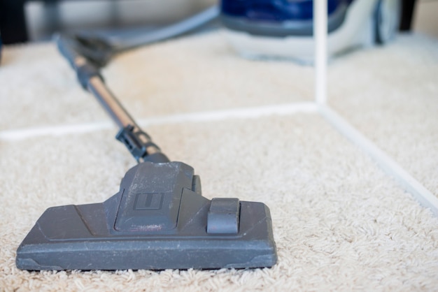 Close-up of a vacuum cleaner on carpet