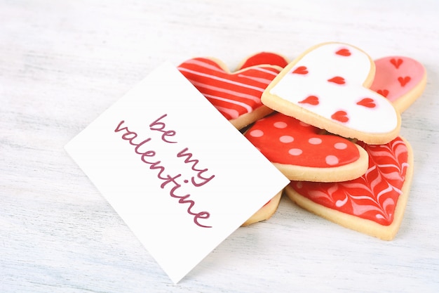 Close up of Valentine's day cookies with greeting card