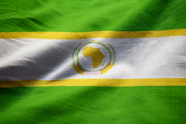 Close-up van de vlag van de Afrikaanse Unie, de Afrikaanse Unie vlag waait in de wind