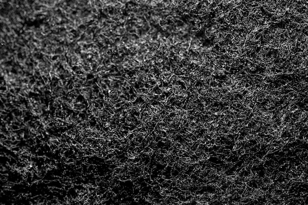 Foto close-up van donkergrijze stof vezelige textuur
