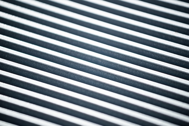 Close-up van een gegolfd metalen oppervlak van een niet-geïdentificeerde fabrieksapparatuur. Het concept van geavanceerde apparatuur en moderne technologie. Het concept van de productie van militaire apparaten