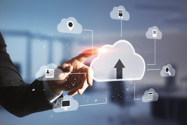 Close-up van een menselijke hand die wijst naar een abstracte digitale wolk op een wazige achtergrond in een kantoorkamer Cloud computing database en technologie concept