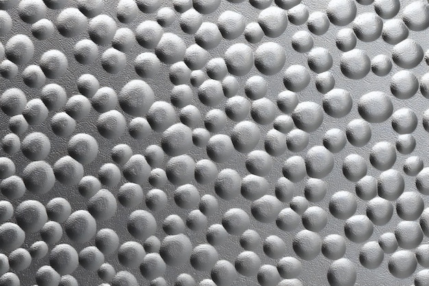 Close-up van een metalen oppervlak met reliëfpatroon