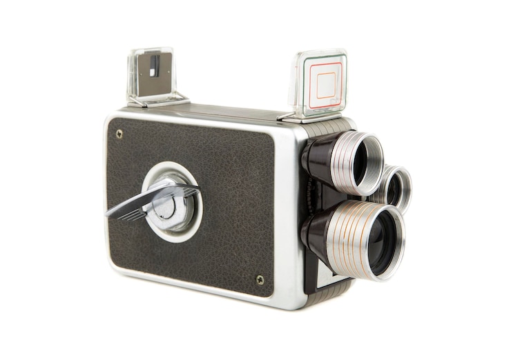 Foto close-up van een vintage thuis videocamera tegen een witte achtergrond