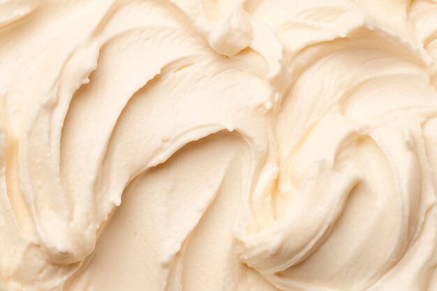 Foto close-up van gladde romige witte whipped cream textuur met zachte wervelingen