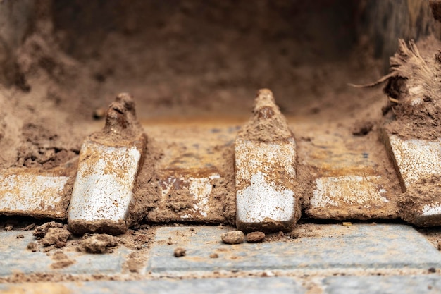 Close up van graafmachine emmer op bouwplaats Bouwmachines voor grondwerken