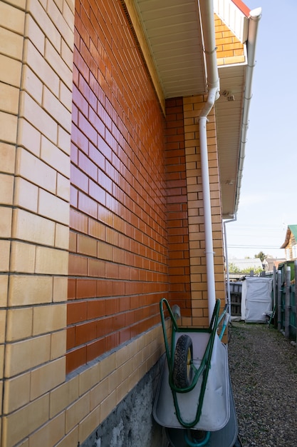 Close up van huis muur gemaakt van nieuwe rode bakstenen achtergrond.