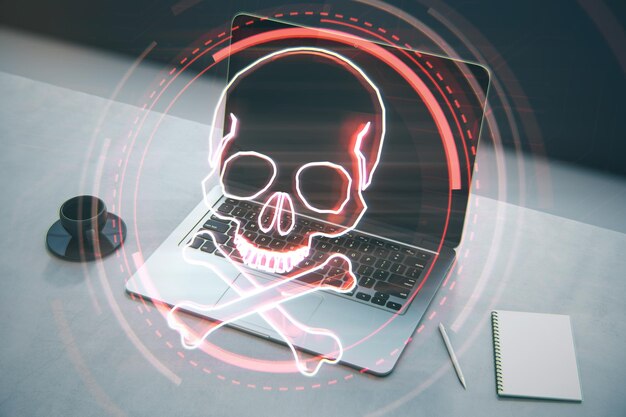 Close-up van laptop Kladblok en koffiekopje op desktop met digitale rode schedel op onscherpe achtergrond Ransomeware virus en piraten dreiging concept Dubbele blootstelling