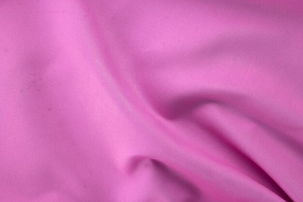 Close-up van roze stof textuur van natura doek in bruine kleur luxe roze stof textuur van natuurlijk katoen of premium linnen textiel materiaal Beige canvas achtergrond