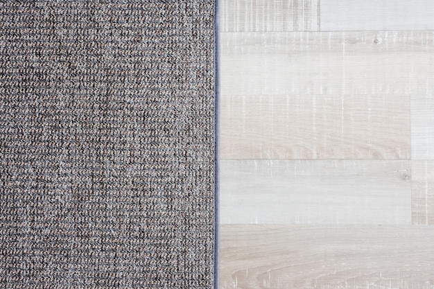Close up van tapijt over houten parketvloer background