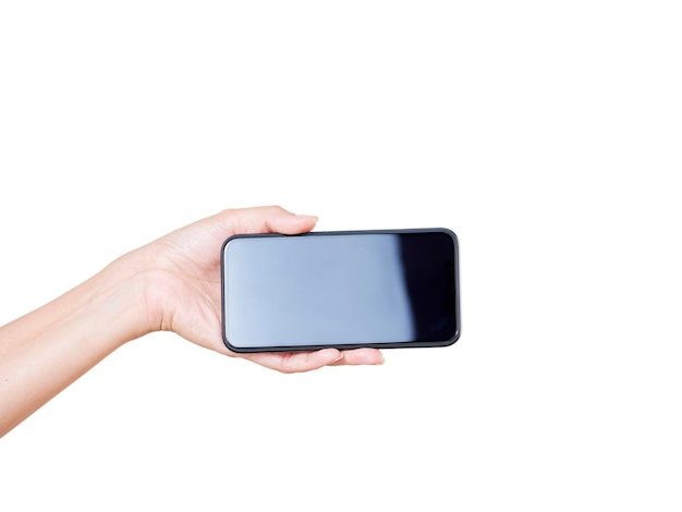 Foto close-up van vrouw hand met smartphone met leeg scherm, mock-up op witte achtergrond