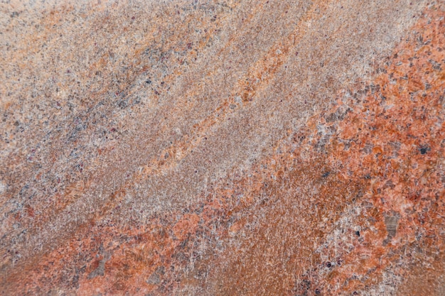 Close-up van zelfs rood granietoppervlak met vlekkerigheid