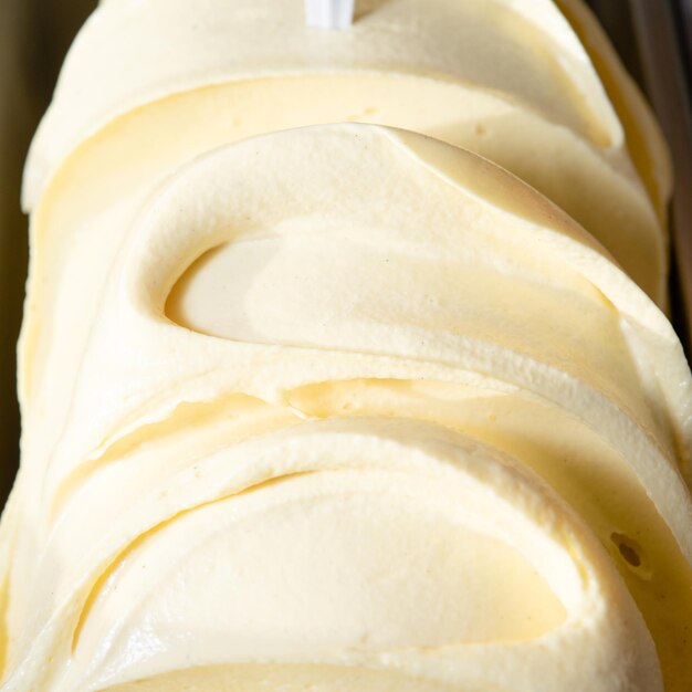 Close up of vanilla ice cream in a box on the counter in the cafe