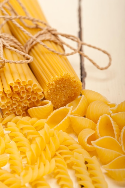 close-up of various pastas on wooden table