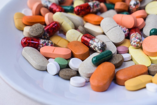 Close up of various pills on plate