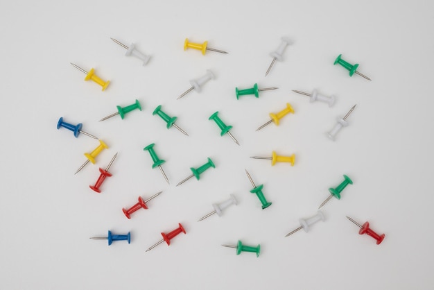 Close up of various pushpins on white background with clipping path