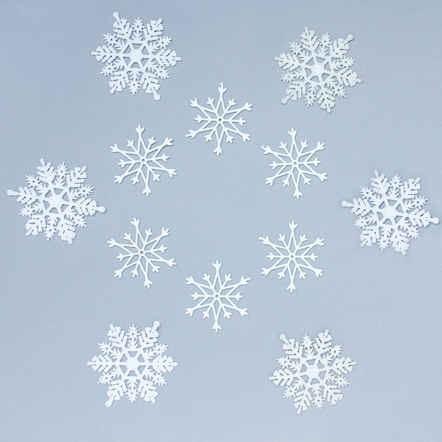 Close up on various shapes of white decorative snowflakes