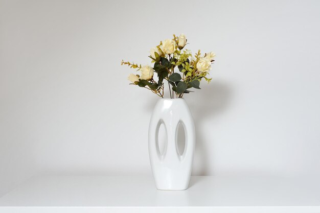 Photo close-up of vase against white background