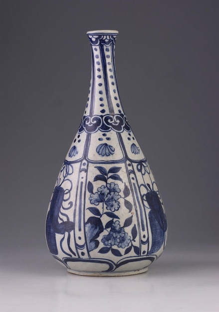 close-up of vase on table against gray background