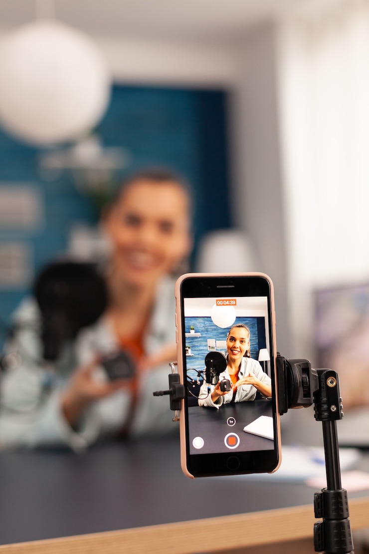 Photo close up of video blogger recording giveaway video for subscribers. creative content creator social media star talking online about professional mouse at home studio podcast