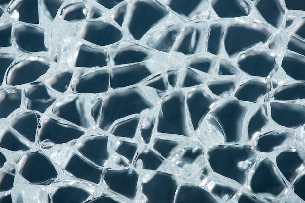 Photo close up view of abstract transparent ice textured background