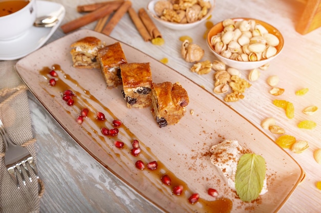 Close up view of beautiful elegant sweet dessert served on the plate Beautiful decoration restaurant dish ready to eat Tea time cozy atmosphere