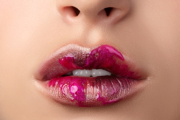 Close up view of beautiful woman lips with modern fashion make up. Different textures on lips. Cosmetology, drugstore or fashion makeup concept.