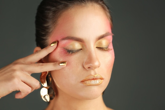 Close up view of beautiful woman with holiday makeup