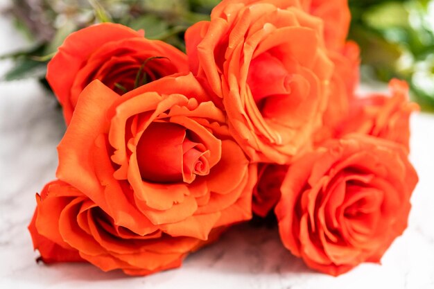 Close up view. Bouquet of red on a marble background.