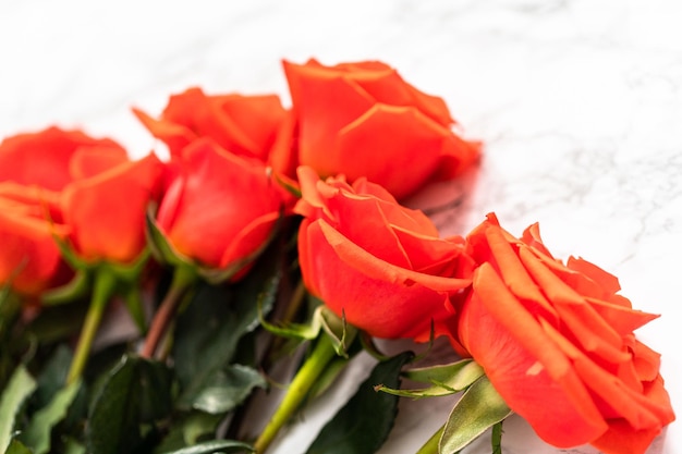 Close up view. Bouquet of red on a marble background.