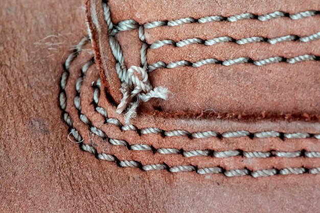 Close up view of brown boot with laces