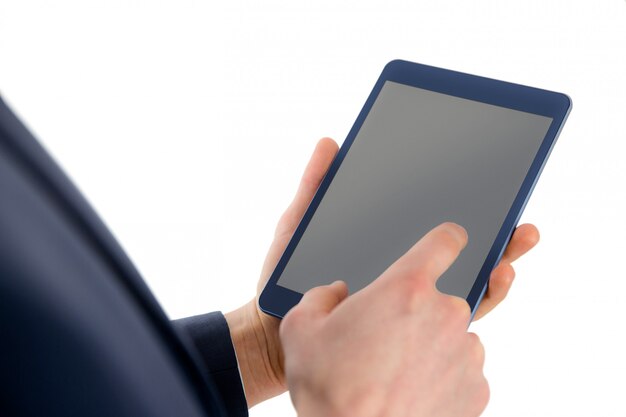 Photo close up view of businessman using tablet computer