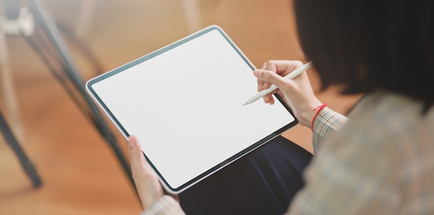 close-up view of businesswoman writing her ideas