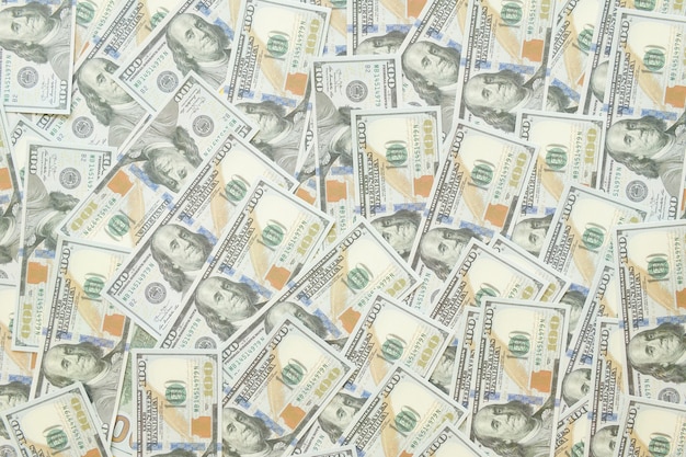 Close up view of cash money dollars bills in amount. close up\
view of cash money dollars bills in amount dollars banknotes\
background. global financial crisis concept