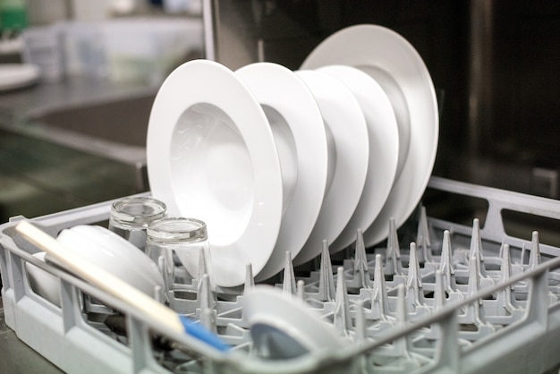 Close up view of clean plates in a dishwasher