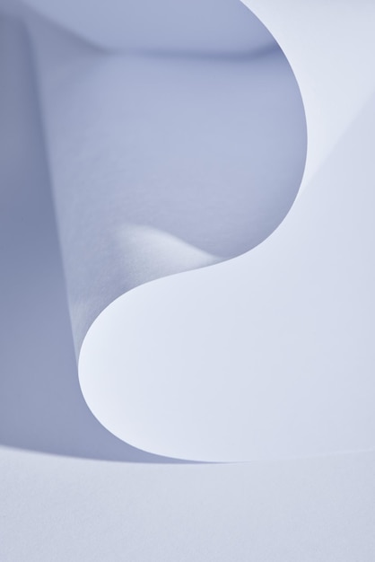 Close up view of curved paper sheet on white background