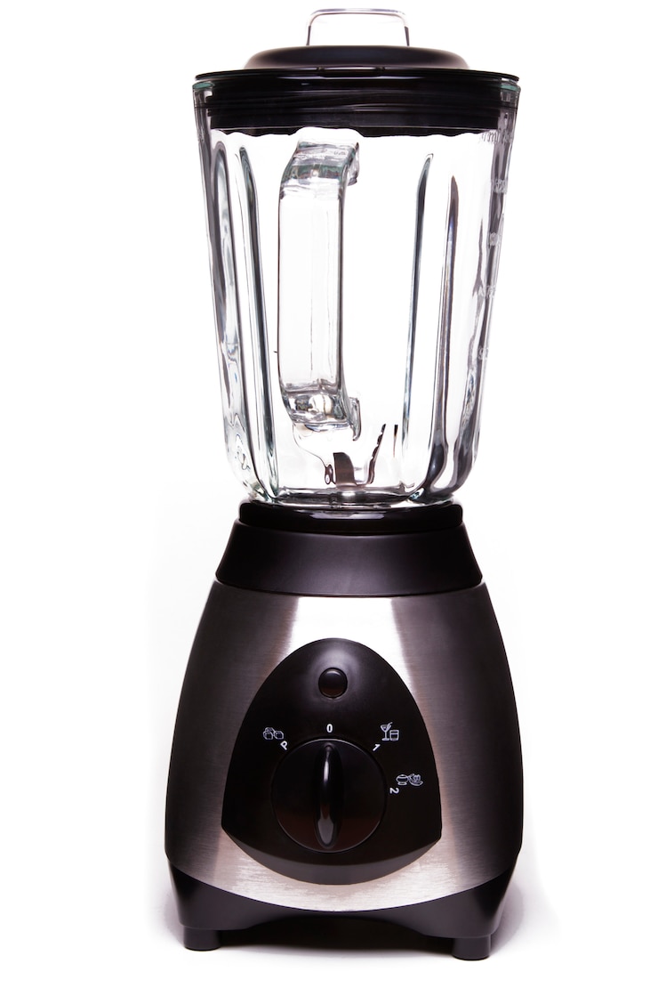 Photo close up view of an electric blender isolated on a white background.