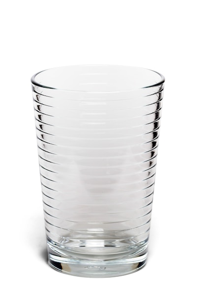 Close up view of an empty glass water cup isolated on a white background.