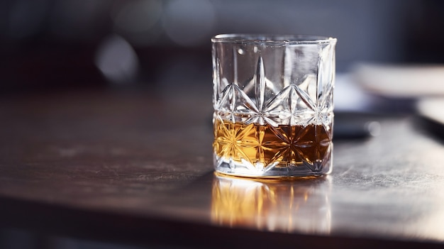 Close up view of glass with alcohol indoors in the restaurant.