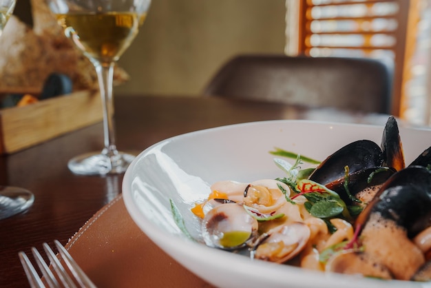 Close up view of the grilled scallop on a plate