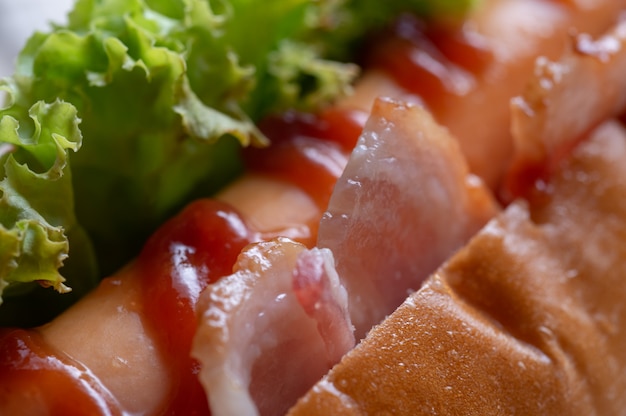 Close up view of hot dog bacon