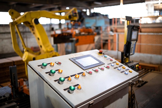 Close up view on industrial computer and control switchboard\
for operating manufacturing machines